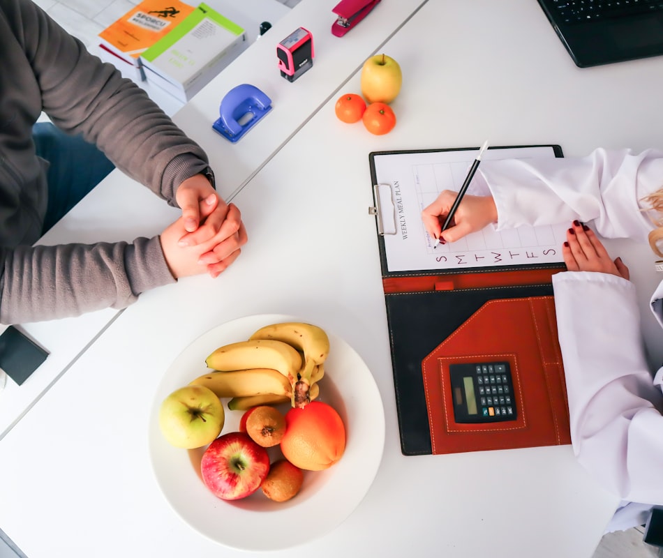 Nutritionist consulting with client